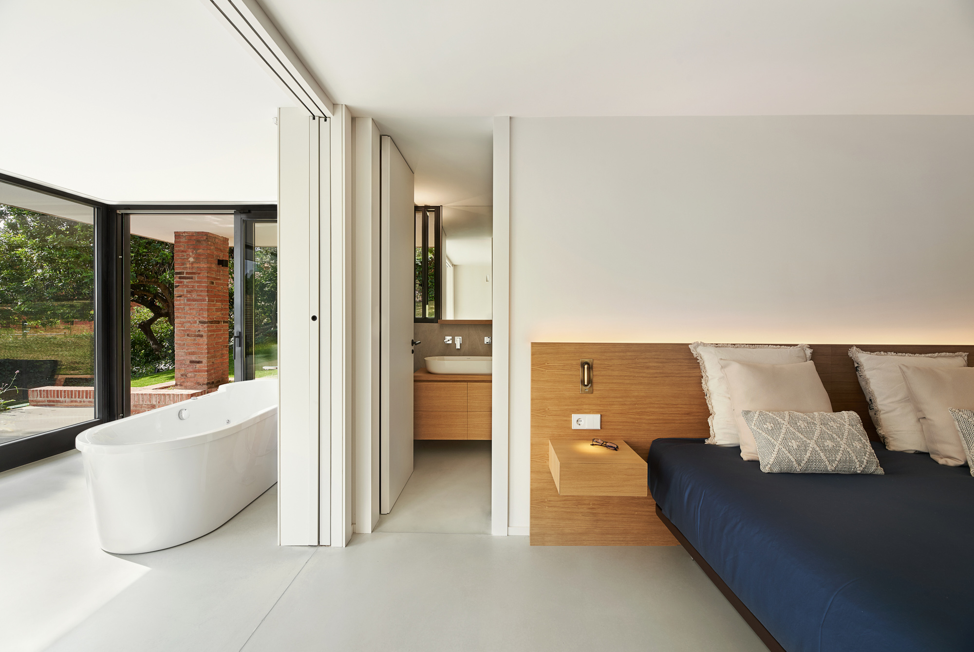 modern bedroom and bathroom design with gardenview