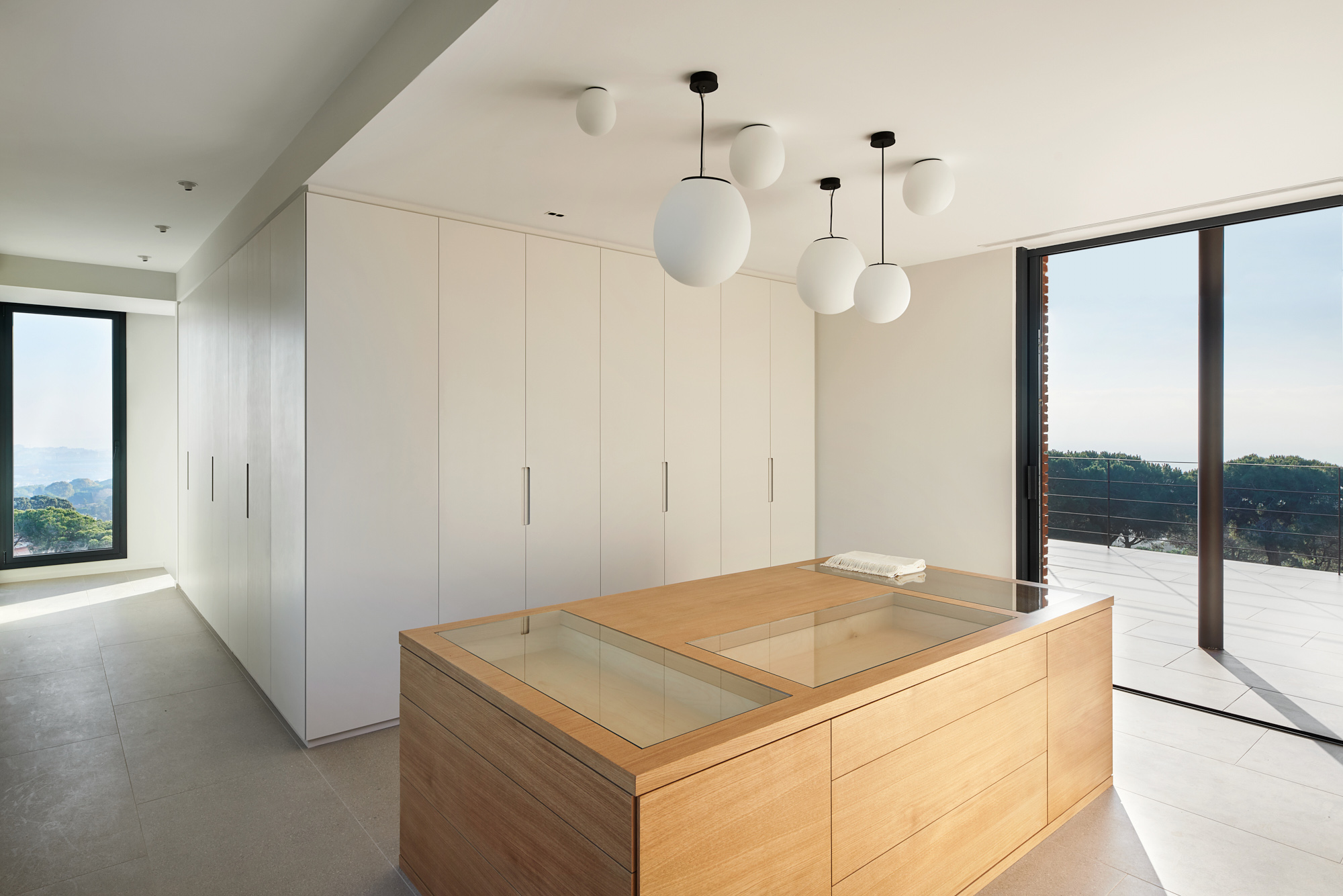 a walkable dresser room with a view overlooking the hills