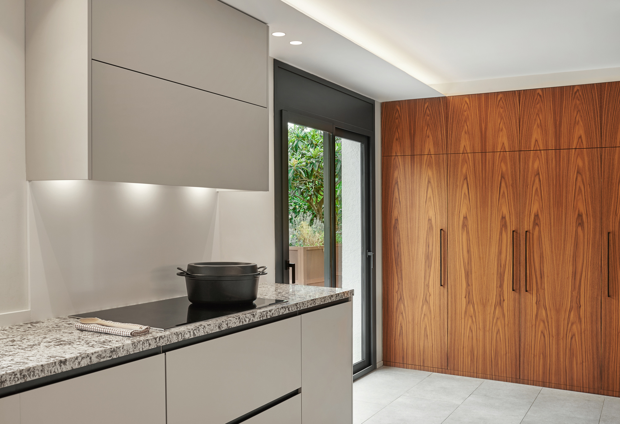 modern minimalist white kitchen with wooden wardrobe