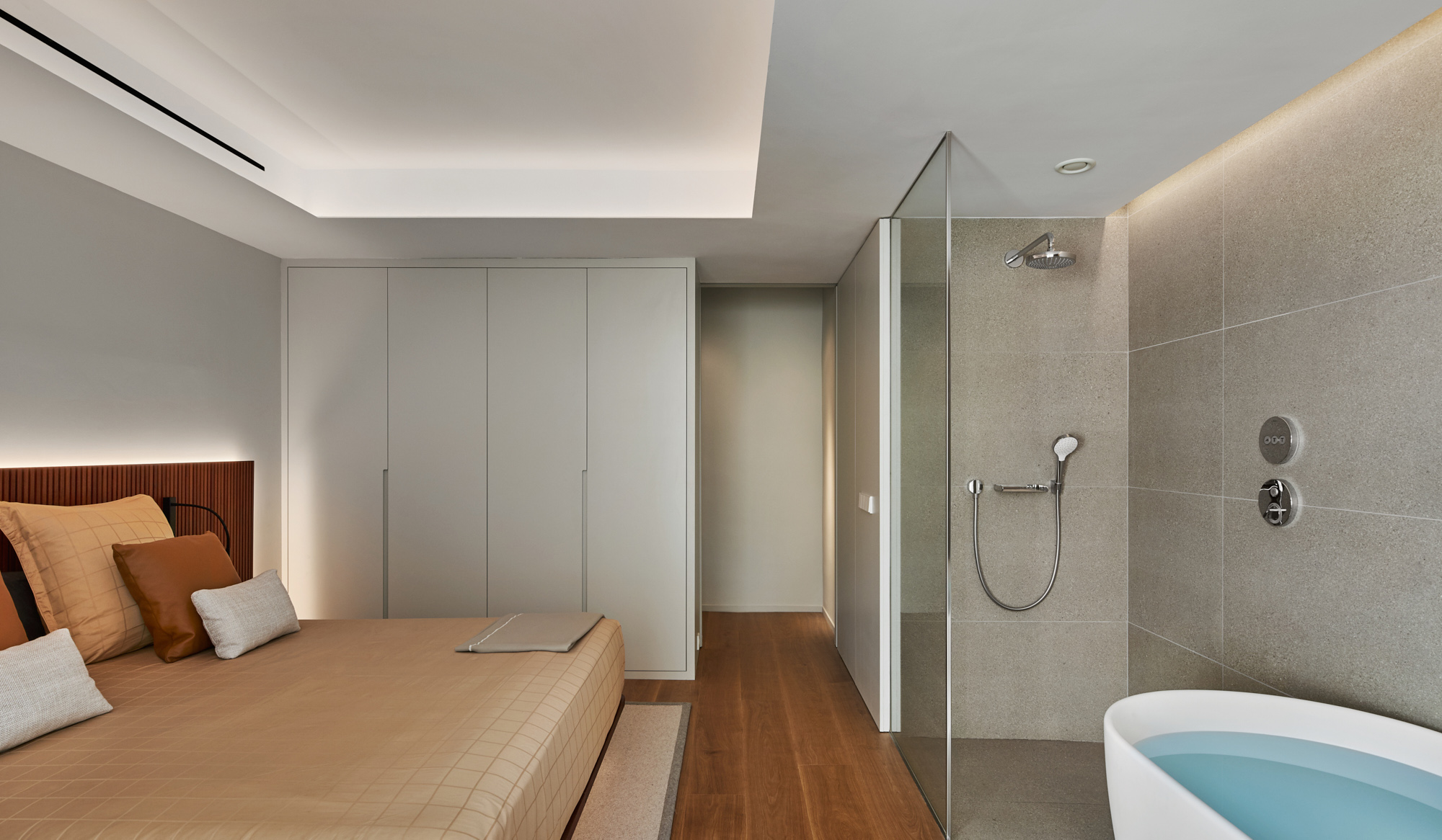 a modern bedroom with integrated bath